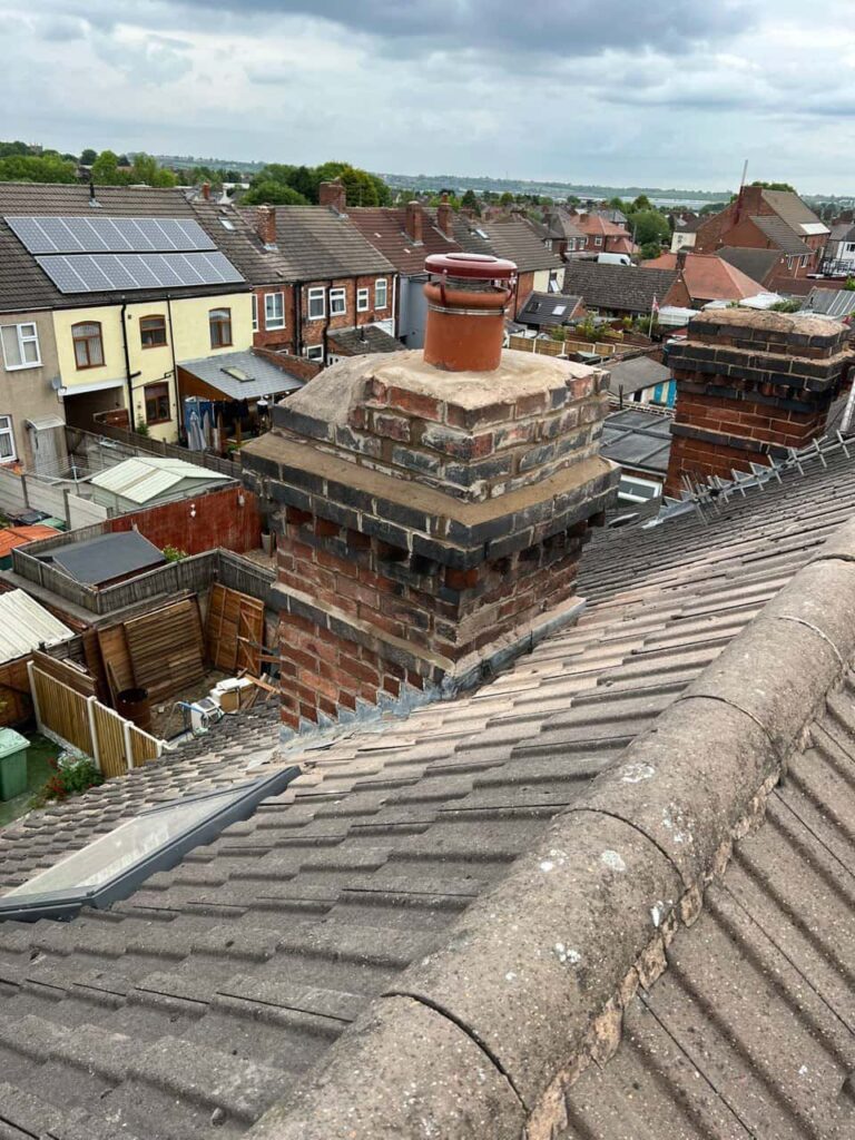 This is a photo taken from a roof which is being repaired by Cambourne Roofing Repairs, it shows a street of houses, and their roofs